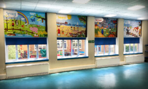 Wall graphics featuring the 4 seasons across a wall in a school hall